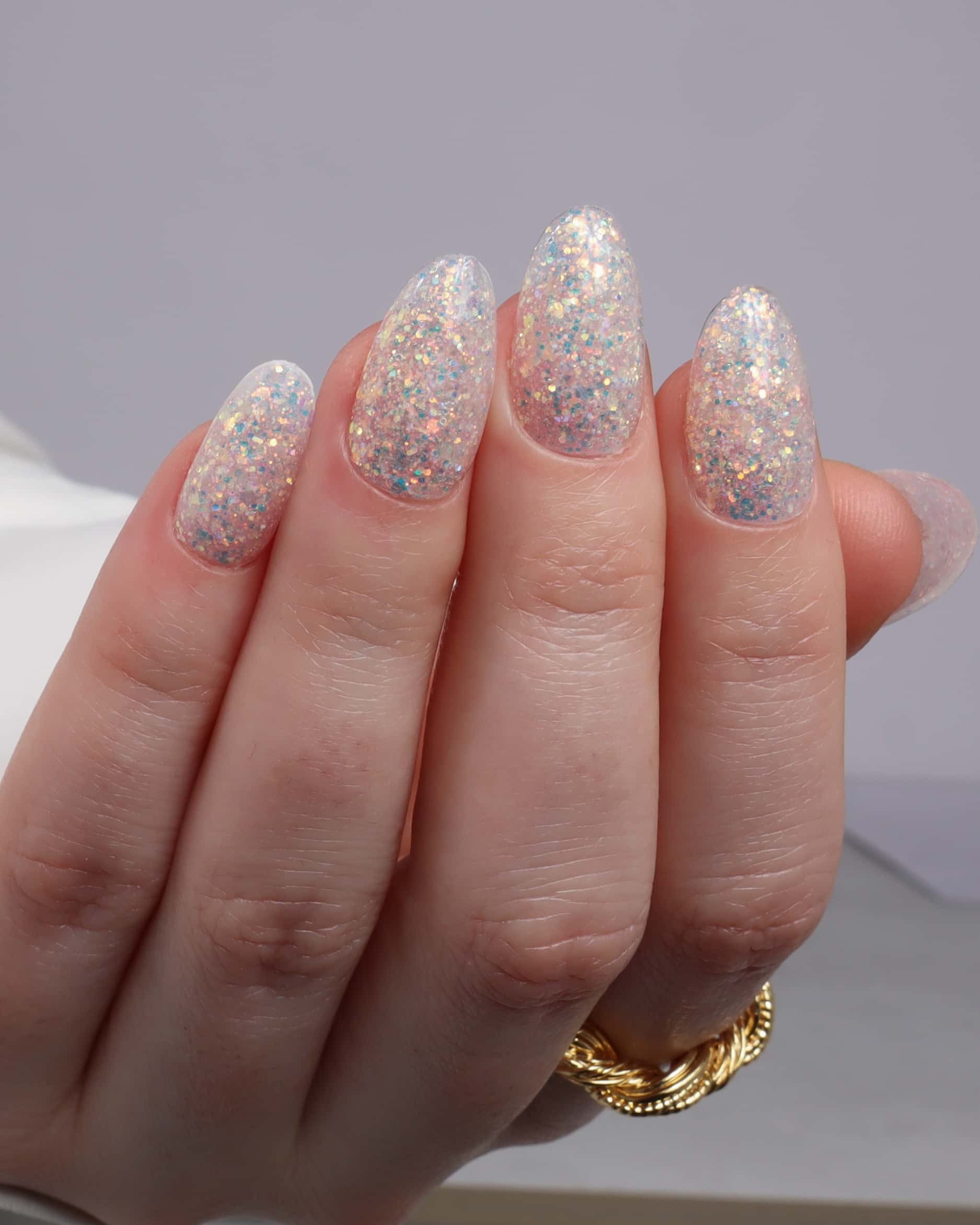 Glitter nails. Encapsulated glitter. Reusable nail extensions. 