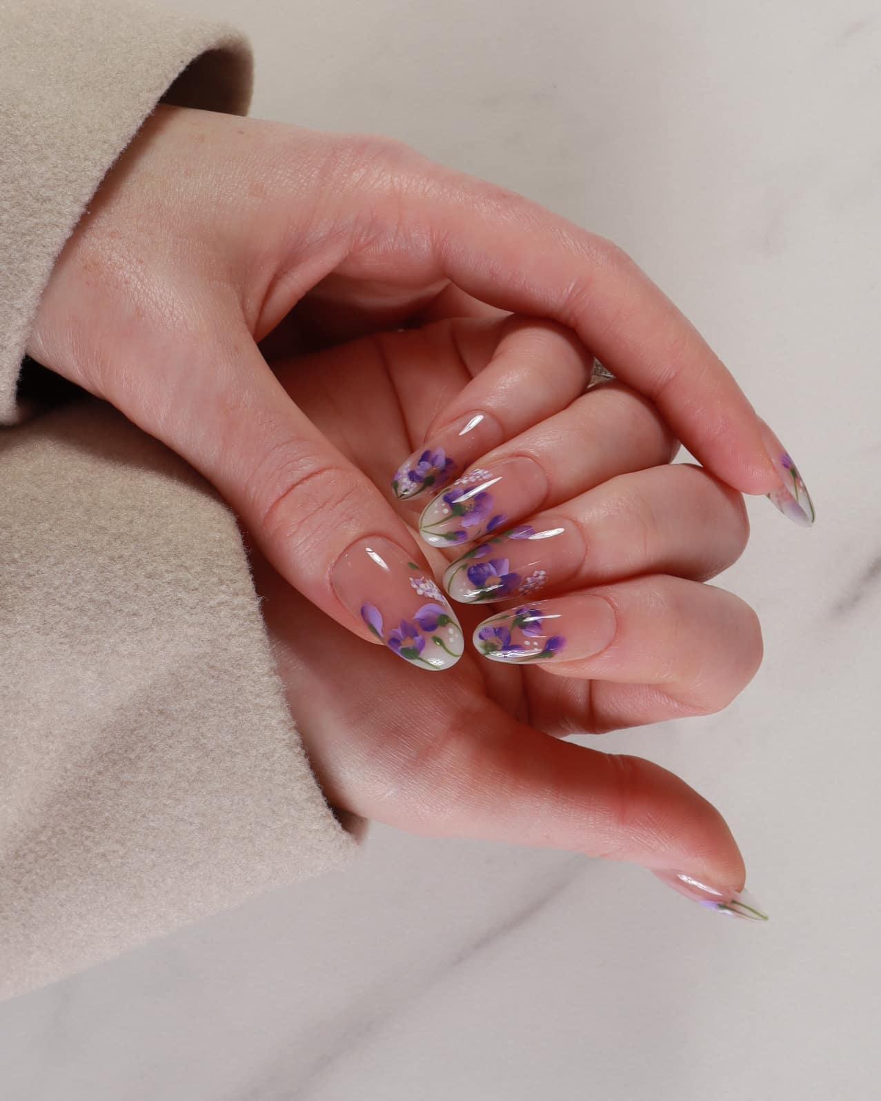 purple flowers nail extensions on hand