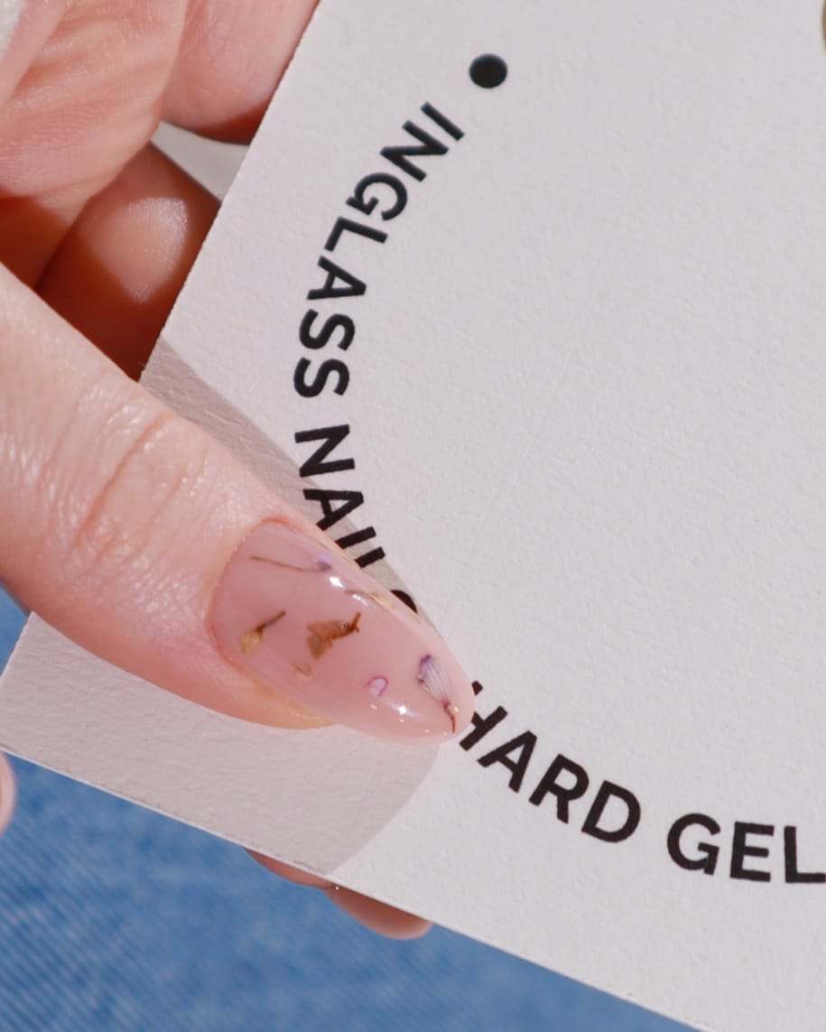 Encapsulated dried flowers nails in a nail insert box