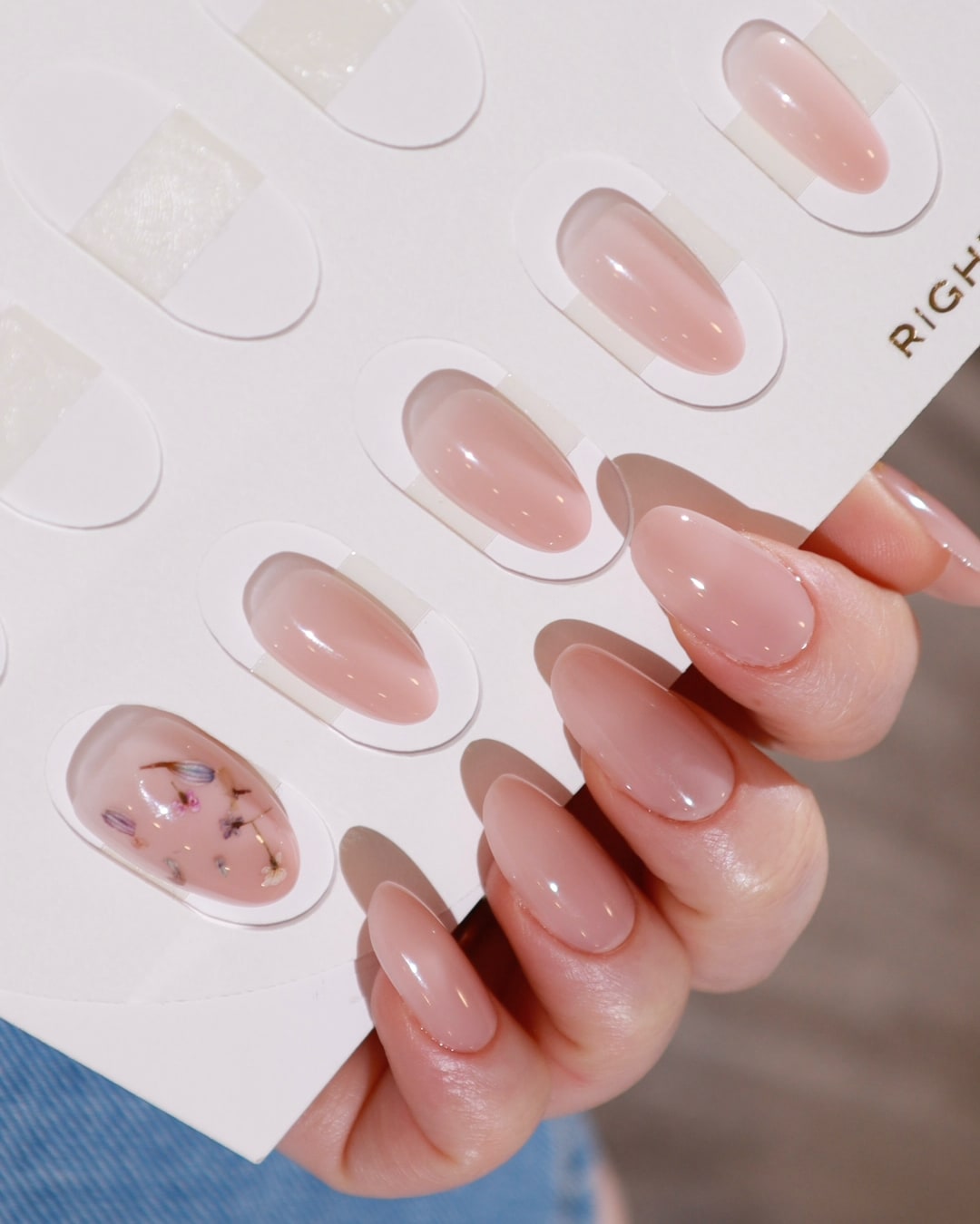 Encapsulated dried flowers nails in a nail insert box